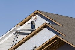 A Man Working - Insulated Vinyl Siding in Utah - Advanced Window Products